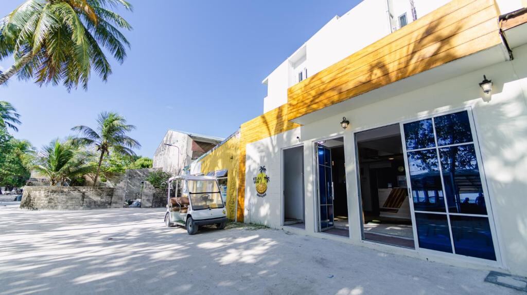 Hotel entrance on the sandy street in Downtown Dhiffushi