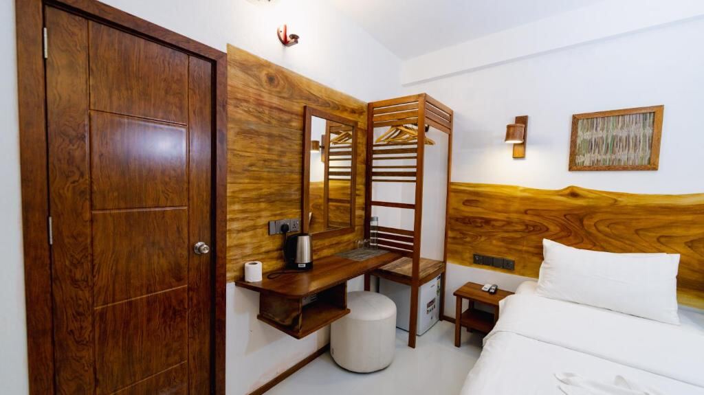 Room interior with wooden details, desk and wardrobe